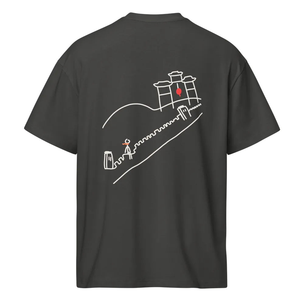 Stop 02 China tee in vintage black, back: hand-drawn stickman in an orange scarf walking the Great Wall